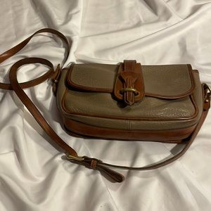 Dooney & Bourke All Weather Leather crossbody purse. Approximately 9x7x2.5 in.